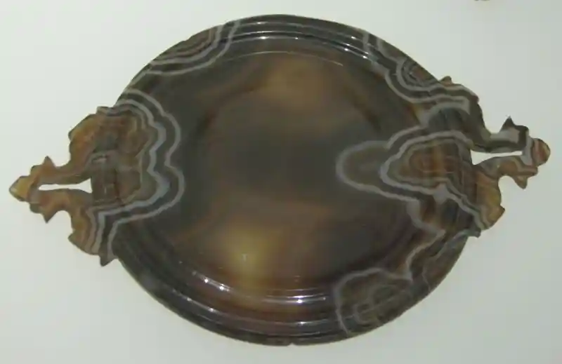 Brown dish with geometrically derived crosses at the right and left